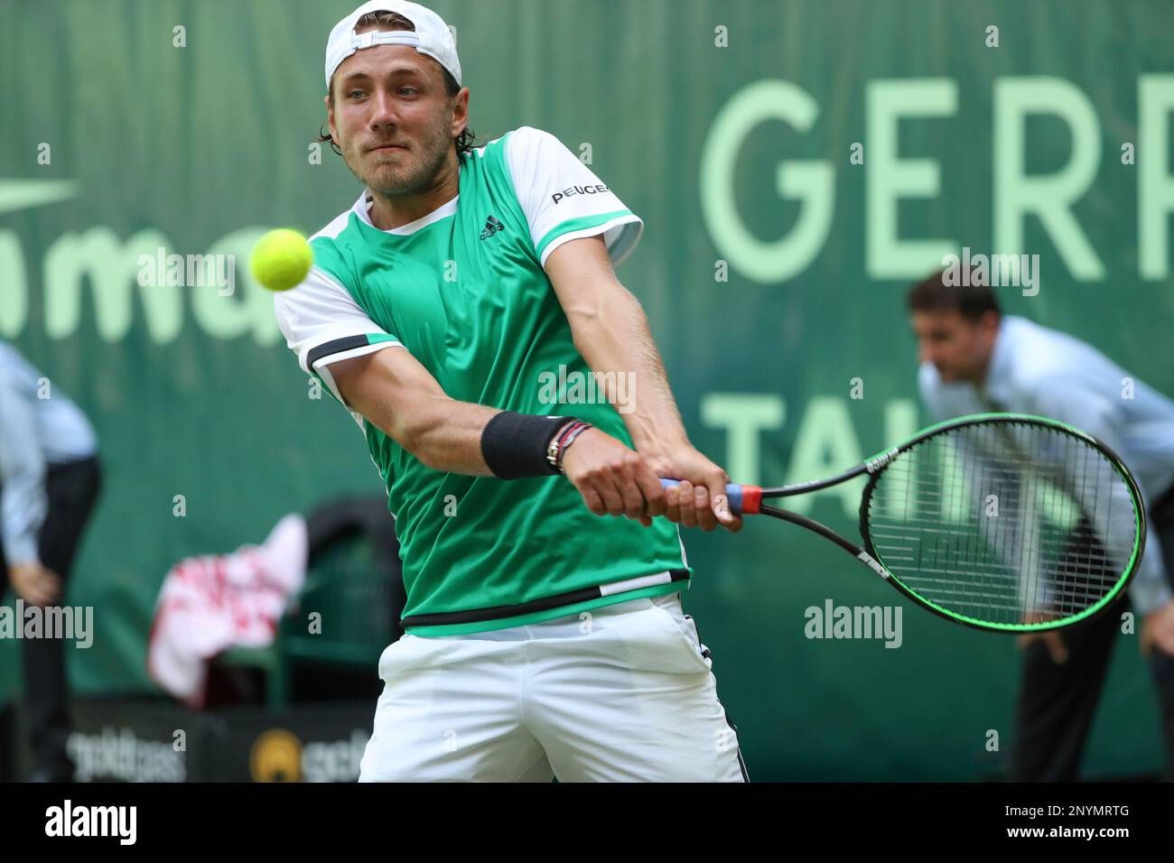 France's Lucas Pouille returns a shot to Germany's Florian Mayer, during  their match at the Gerry Weber Open tennis tournament in Halle, Germany,  Thursday, June 22, 2017. ( Friso Gentsch/dpa via AP