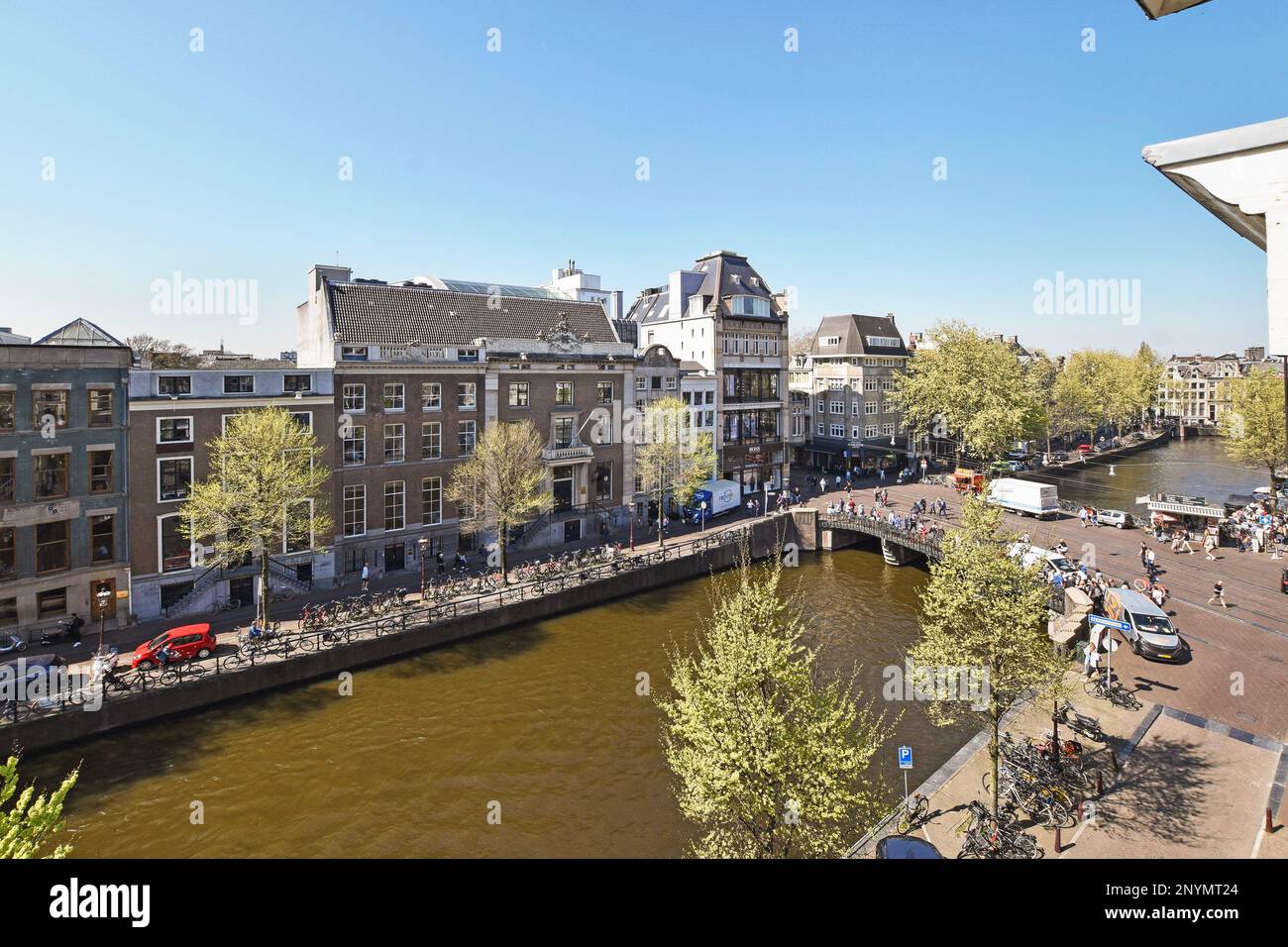 Amsterdam, Netherlands - 10 April, 2021: some buildings and people ...
