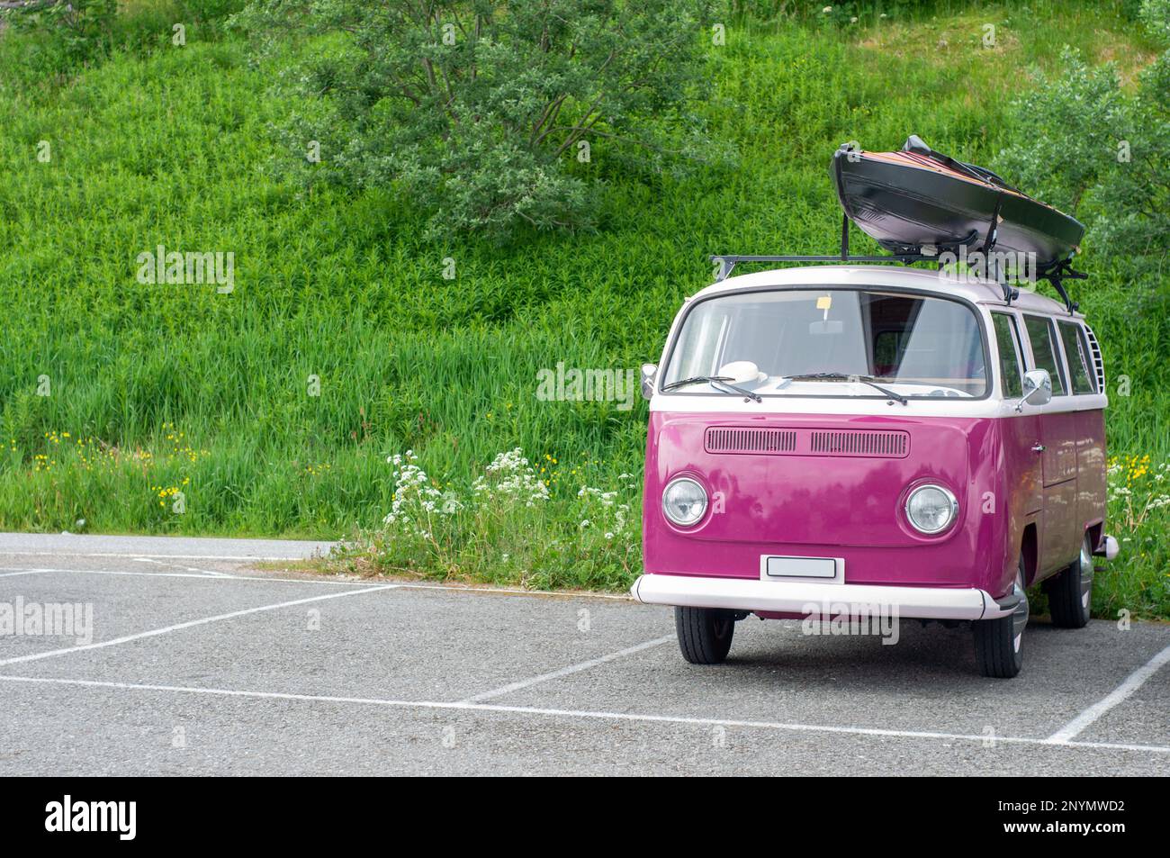 Old van with boat or kayak on roof top on parking place Stock Photo - Alamy