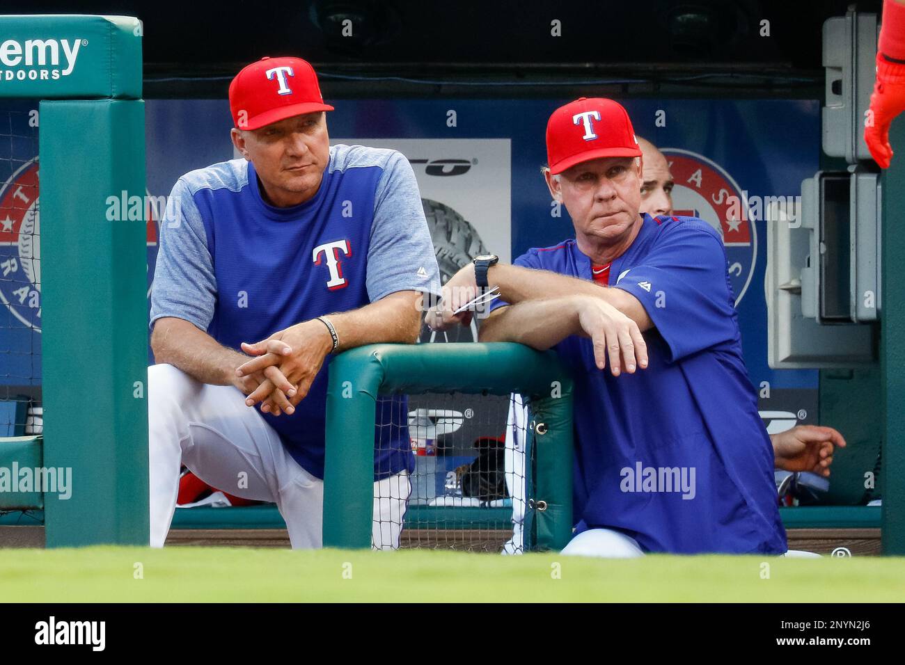 ARLINGTON, TX - JUNE 19: Texas Rangers Manager Jeff Banister and  bench.coach Steve Buechele look on from the dugout steps during the MLB  game between the Toronto Blue Jays and Texas Rangers