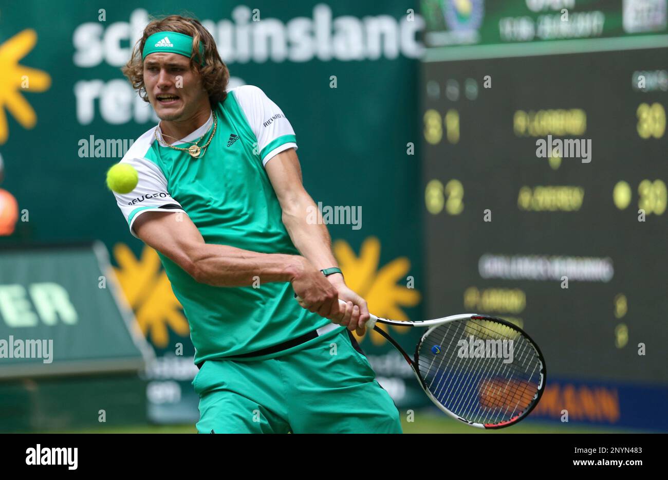 Germany's Alexander Zverev returns a shot to Italy's Paolo Lorenzi during  their match at the Gerry Weber Open ATP tennis tournament in Halle,  Germany, Tuesday, June 20, 2017. (Friso Gentsch/dpa via AP