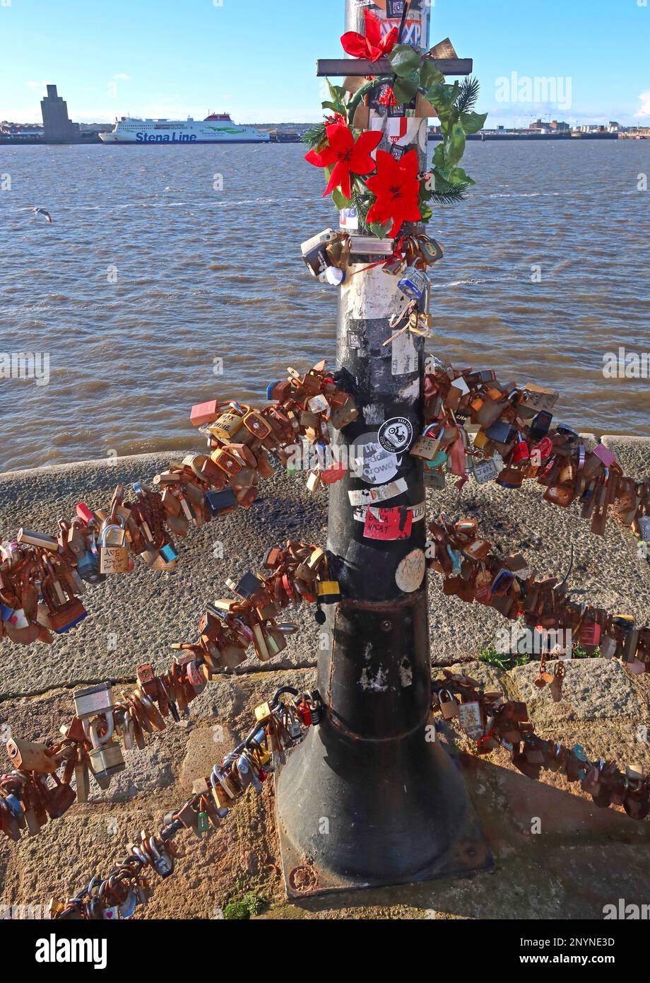 Love padlocks on the chains at the river Mersey promenade, Pier Head, Royal Albert Dock, Liverpool, Merseyside, England, UK,  L3 4AF Stock Photo