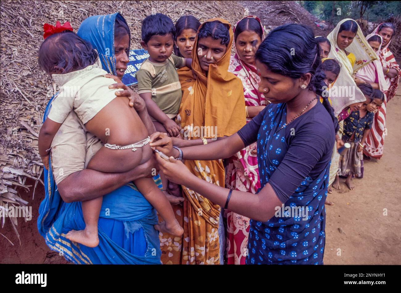 India, Tamil Nadu. A nurse is vaccinating a child. Stock Photo