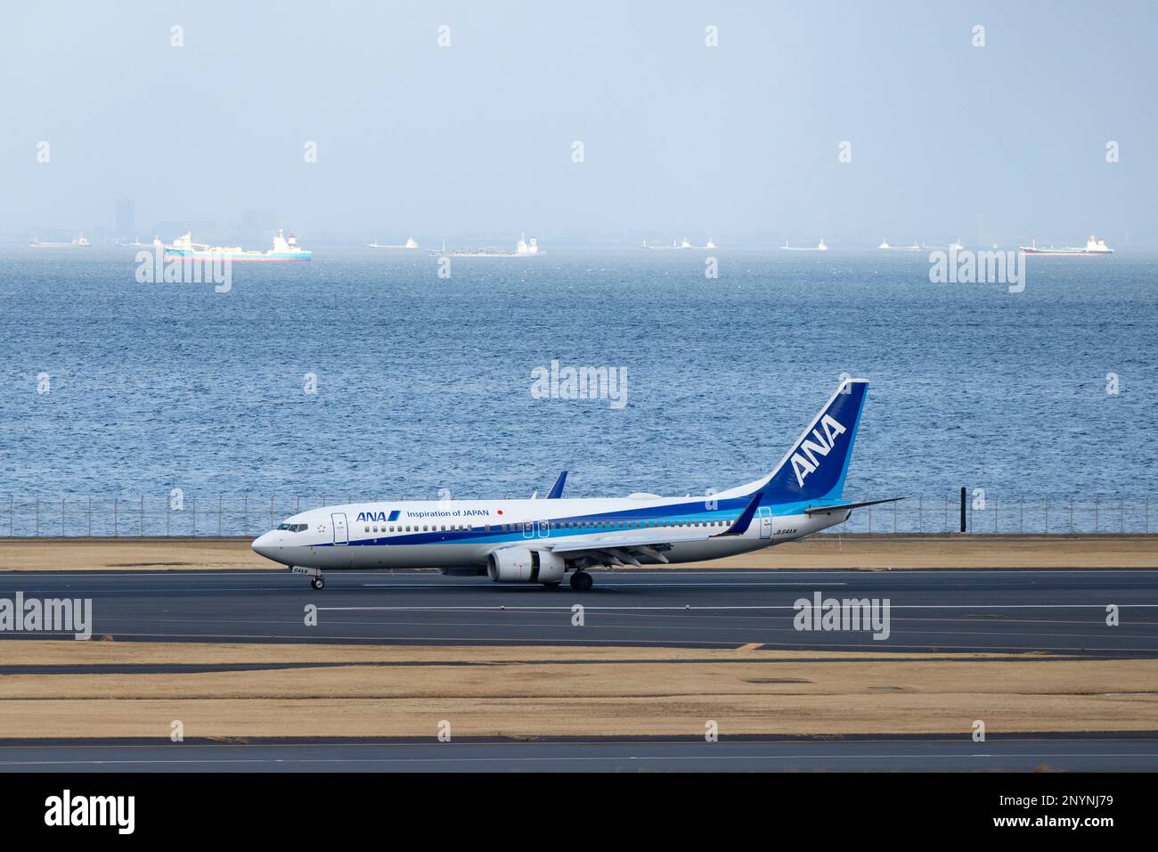 March 2, 2023, Tokyo, Japan: An ANA Boeing 737-800 NG (JA64AN) at Tokyo Haneda International Airport. (HND) The airline industry faces a severe staffing and pilot shortage as international travel rebounds after the COVID-19 pandemic.ANA (All Nippon Airways å…¨æ-¥æœ¬ç © ºè¼¸æ ªå¼ä¼šç¤¾) is one of the leading airlines in the Asia-Pacific region. Founded in 1952, it has grown to become the largest airline in Japan, operating both domestic and international flights. ANA has a fleet of over 250 aircraft, including Boeing 787 Dreamliners and Airbus A380s, and serves more than 100 destinations in As Stock Photo