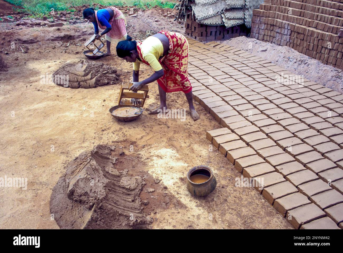 India. Women making bricks. Stock Photo