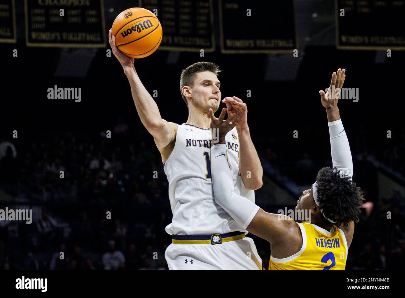 South Bend, Indiana, USA. 01st Mar, 2023. Notre Dame forward Nate Laszewski (14) passes the ball as Pittsburgh forward Blake Hinson (2) defends during NCAA basketball game action between the Pittsburgh Panthers and the Notre Dame Fighting Irish at Purcell Pavilion at the Joyce Center in South Bend, Indiana. Notre Dame defeated Pittsburgh 88-81. John Mersits/CSM/Alamy Live News Stock Photo