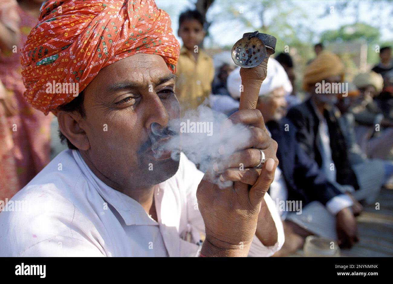 India, Rajasthan. A man is smoking opium Stock Photo - Alamy