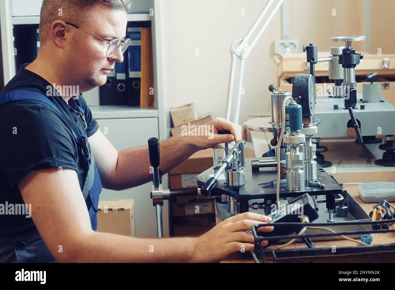 Professional calibration of pressure gauges and sensors. Working person