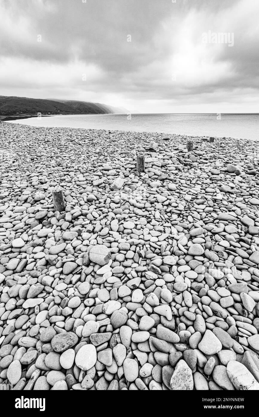 The stony beach at Bossington (looking towards Porlock Weir) on the north coast of Exmoor National Park, Somerset, England UK Stock Photo