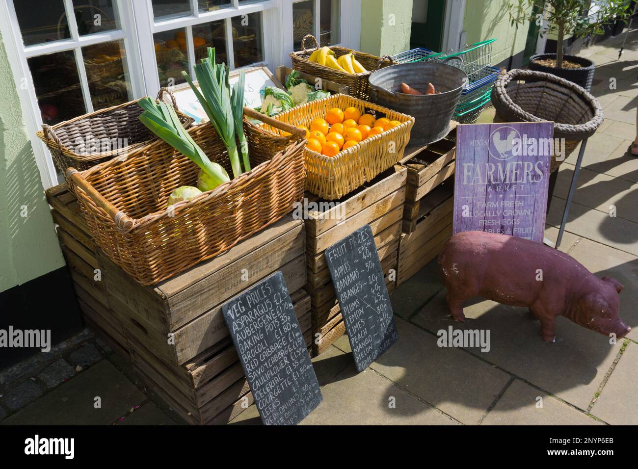 Traditional fresh fruit and vegetables pavement display outside a small independent Welsh green grocers shop in Beaumaris Wales Stock Photo