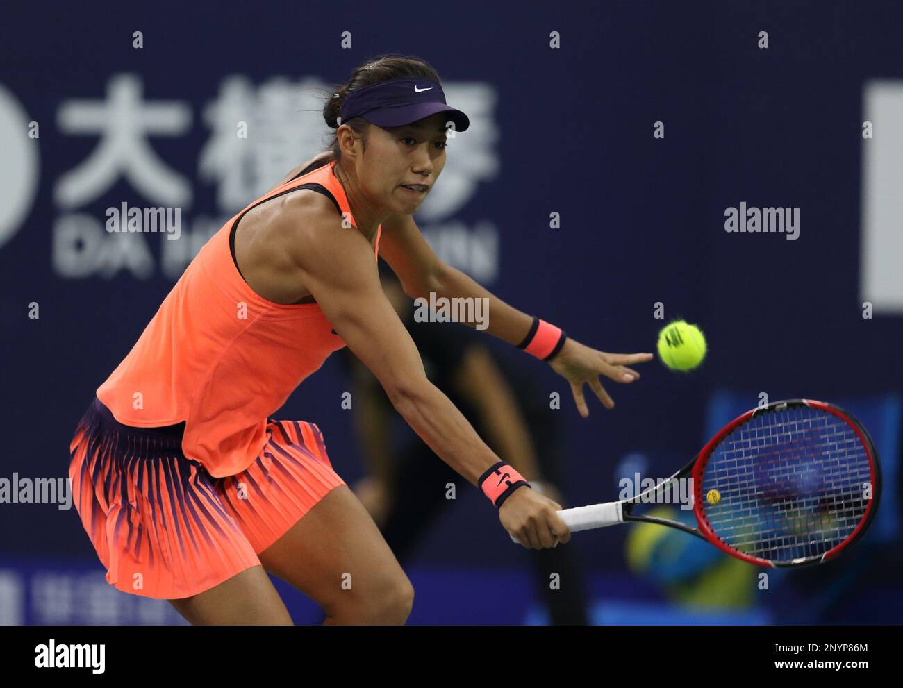 FILE--Zhang Shuai of China returns a shot to Petra Kvitova of Czech Republic in their semifinal match of the womens singles during the 2016 WTA Eli Stock Photo