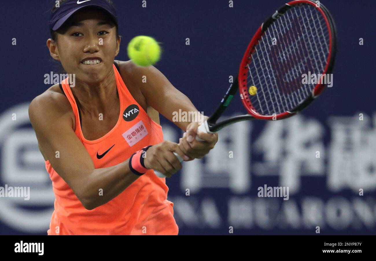 FILE--Zhang Shuai of China returns a shot to Petra Kvitova of Czech Republic in their semifinal match of the womens singles during the 2016 WTA Elite Trophy tennis tournament in Zhuhai city,