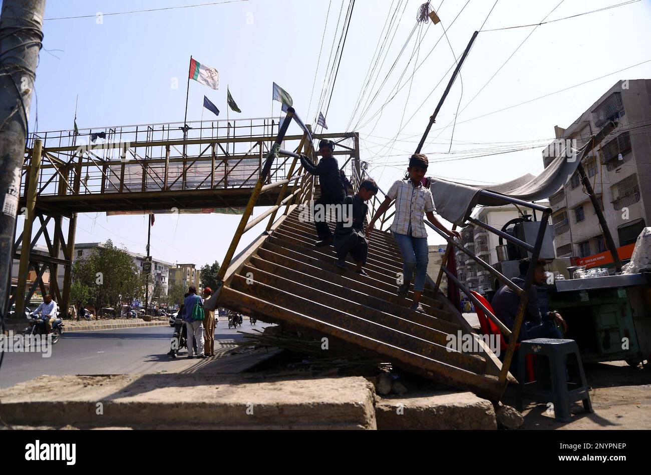 Commuters Pass Through The Damaged Pedestrian Bridge That May Cause Any