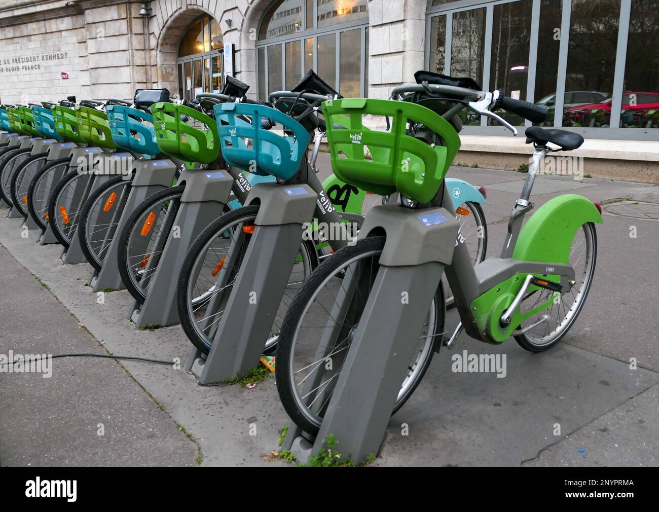 Paris France. February 19. 2023. A row of electric bikes for self service rental in front of an RER station. velib bike station Stock Photo Alamy