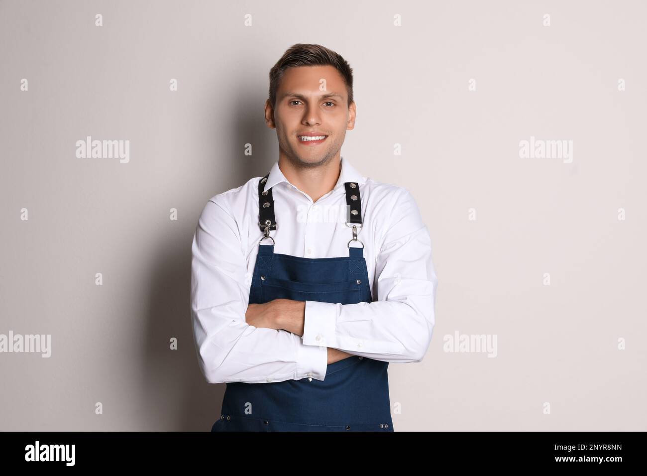 Waiter in uniform hi-res stock photography and images - Alamy