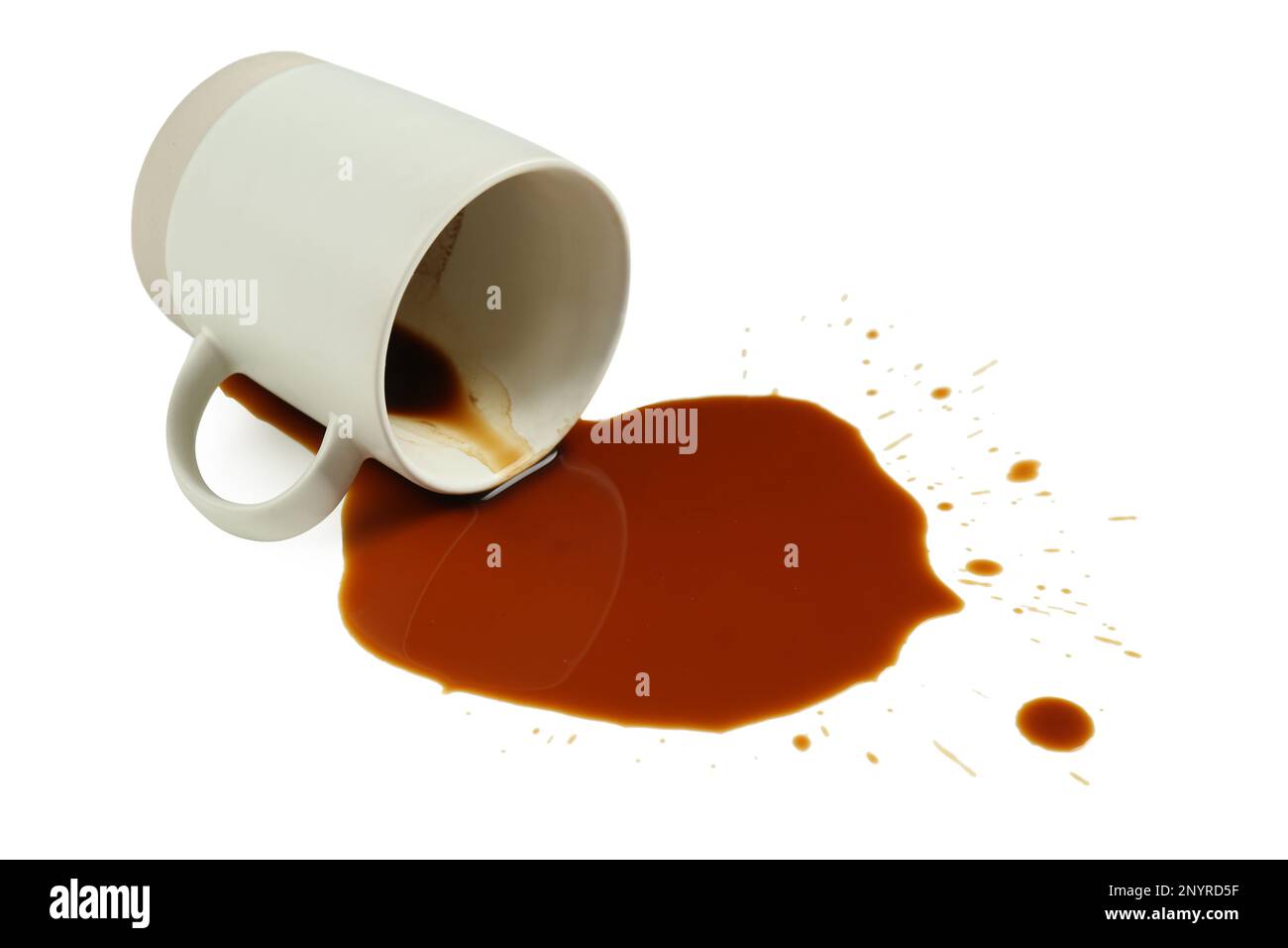 Overturned cup and spilled coffee on white background Stock Photo Alamy