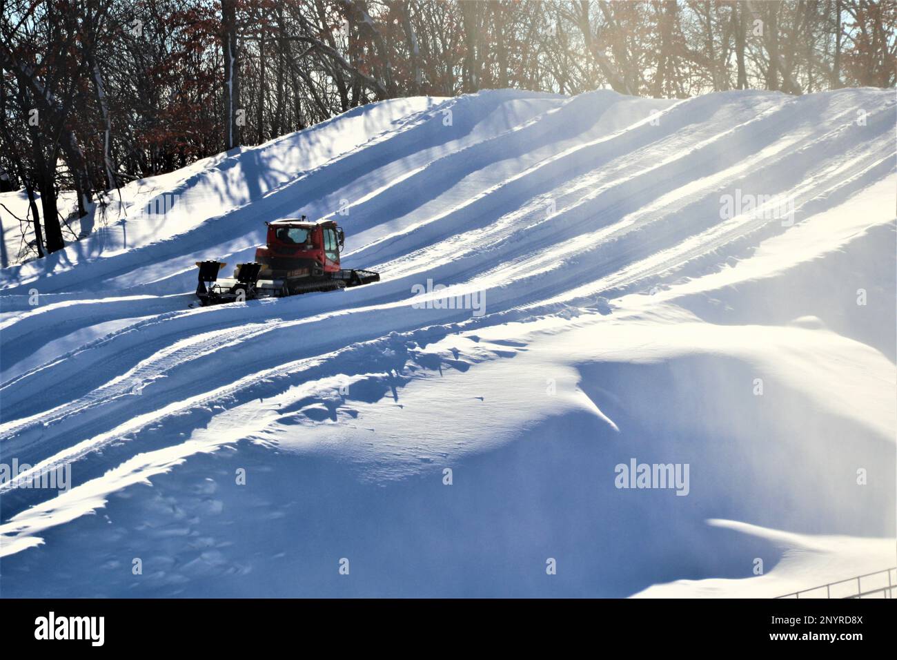 An employee operates a groomer on a hill Jan. 26, 2023, at Whitetail Ridge Ski Area at Fort