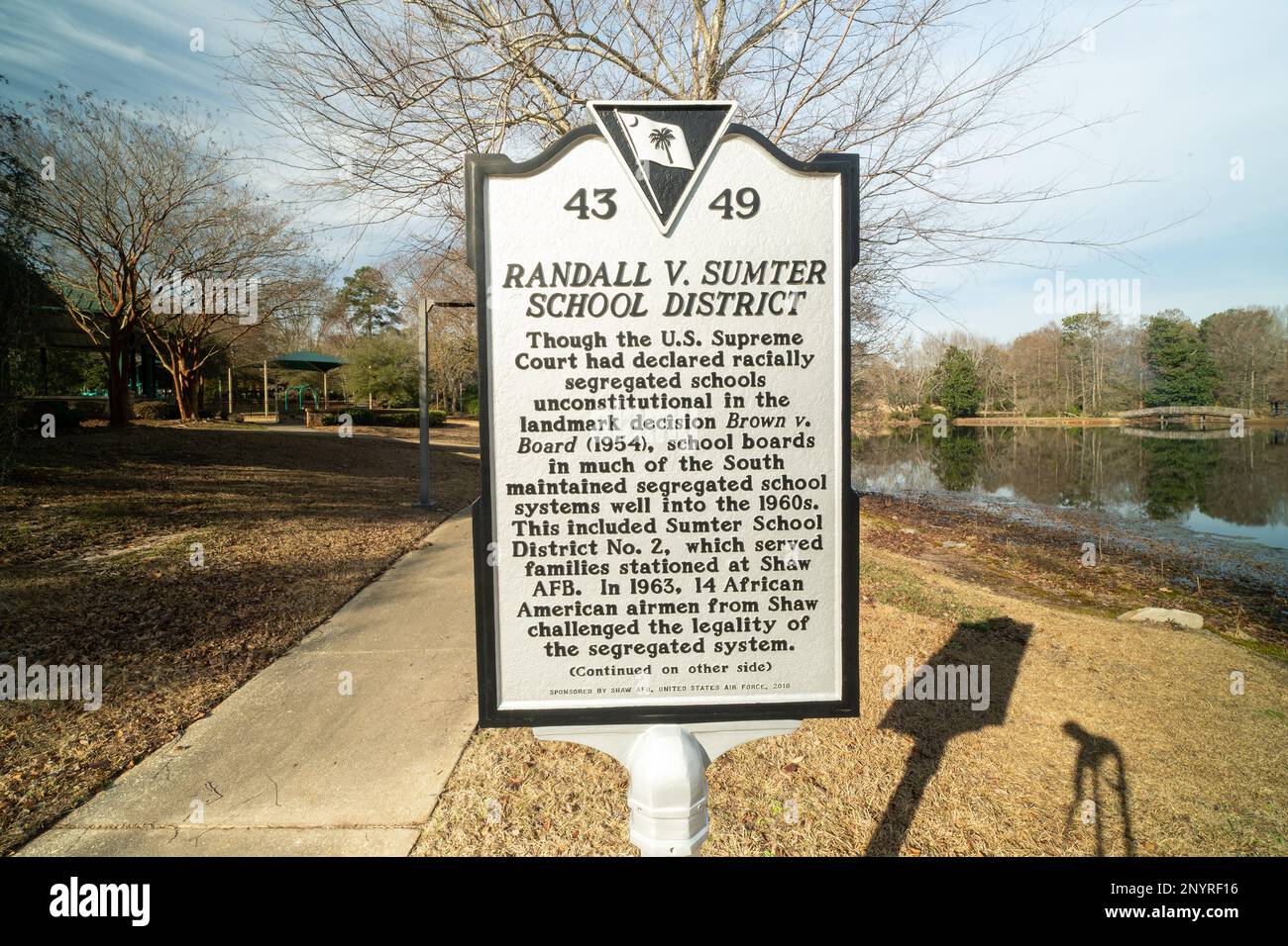 Historical state marker located at Memorial Lake on Shaw Air Force Base, South Carolina, is dedicated to the 'Shaw 14,' African American Airmen stationed at Shaw, who filed a lawsuit against the Sumter School District to end segregation. Stock Photo