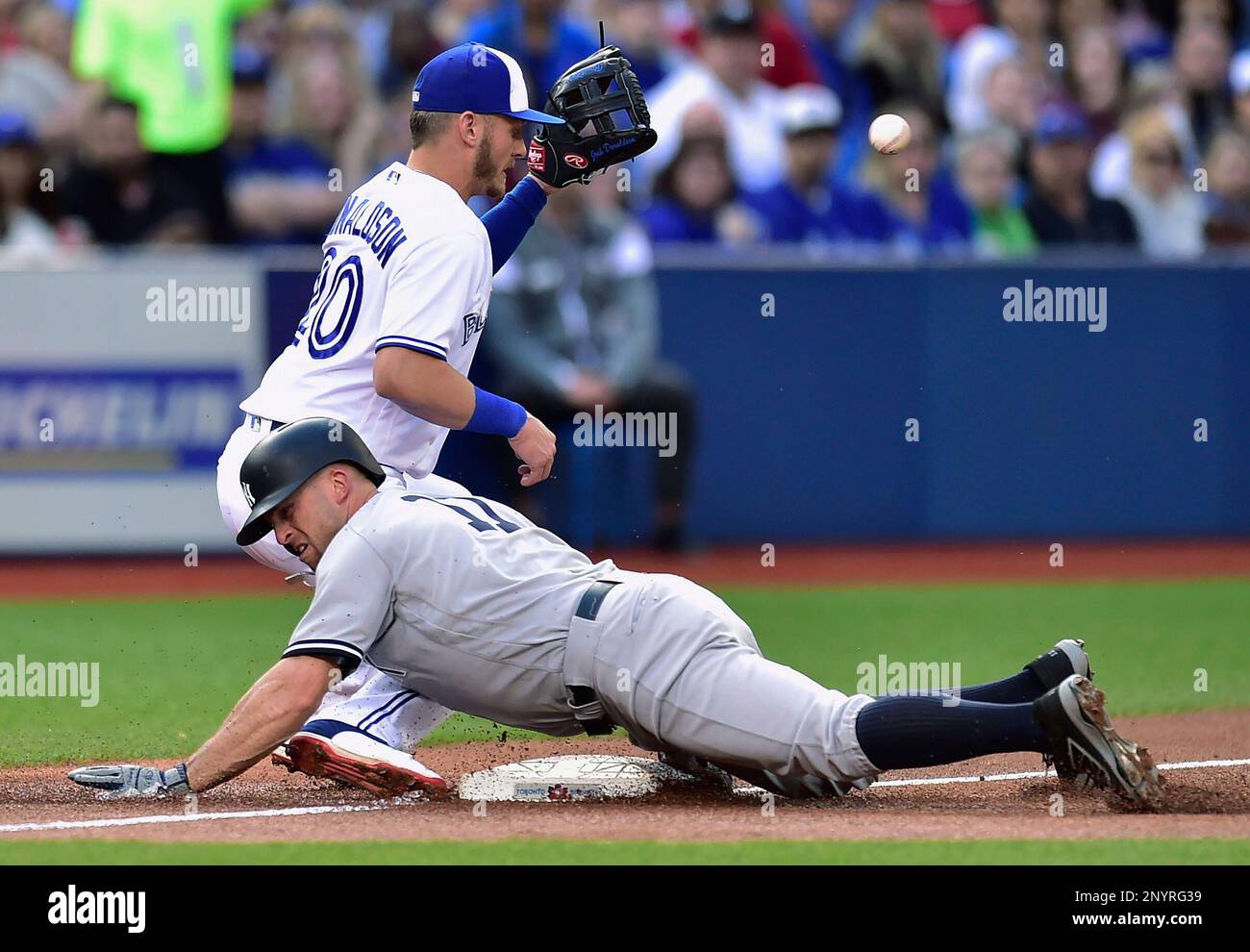 New York Yankees' Brett Gardner (11) slides safely into third base