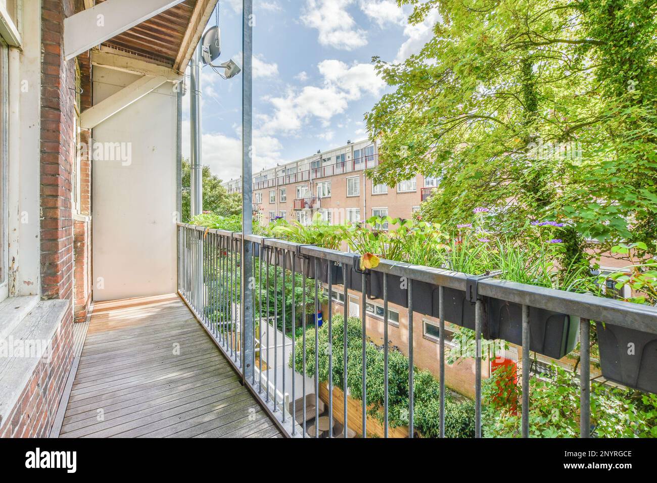 Amsterdam, Netherlands - 10 April, 2021: an apartment balcony with plants and flowers on the balk's front porch in new york, n y Stock Photo