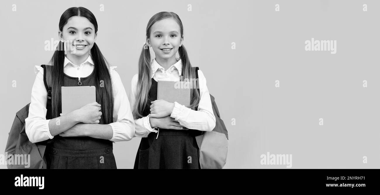 School girls friends. Committed to excellence in learning. Happy children hold study books. Study and education. Banner of school girl student Stock Photo