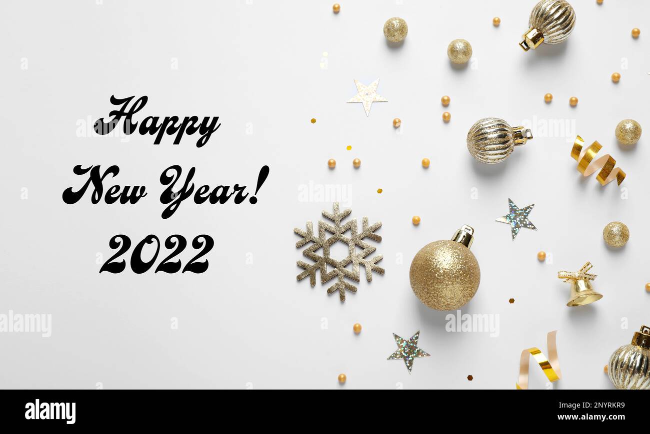 Happy New 2022 Year! Flat lay composition with decorations on white background Stock Photo