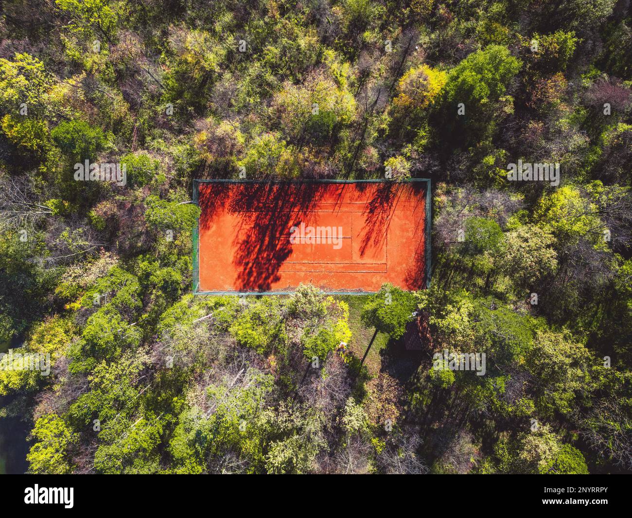 Orange sand on the tennis court top down view, tennis court in the