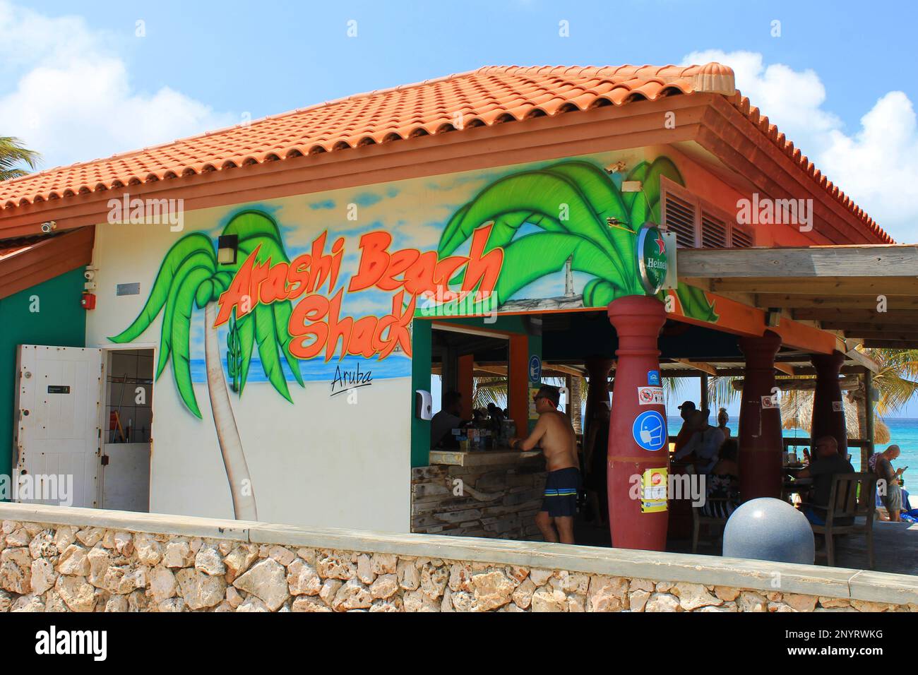 Arashi Beach, Noord, Aruba - March 10, 2022. People at the bar, Arashi Beach Shack. Stock Photo