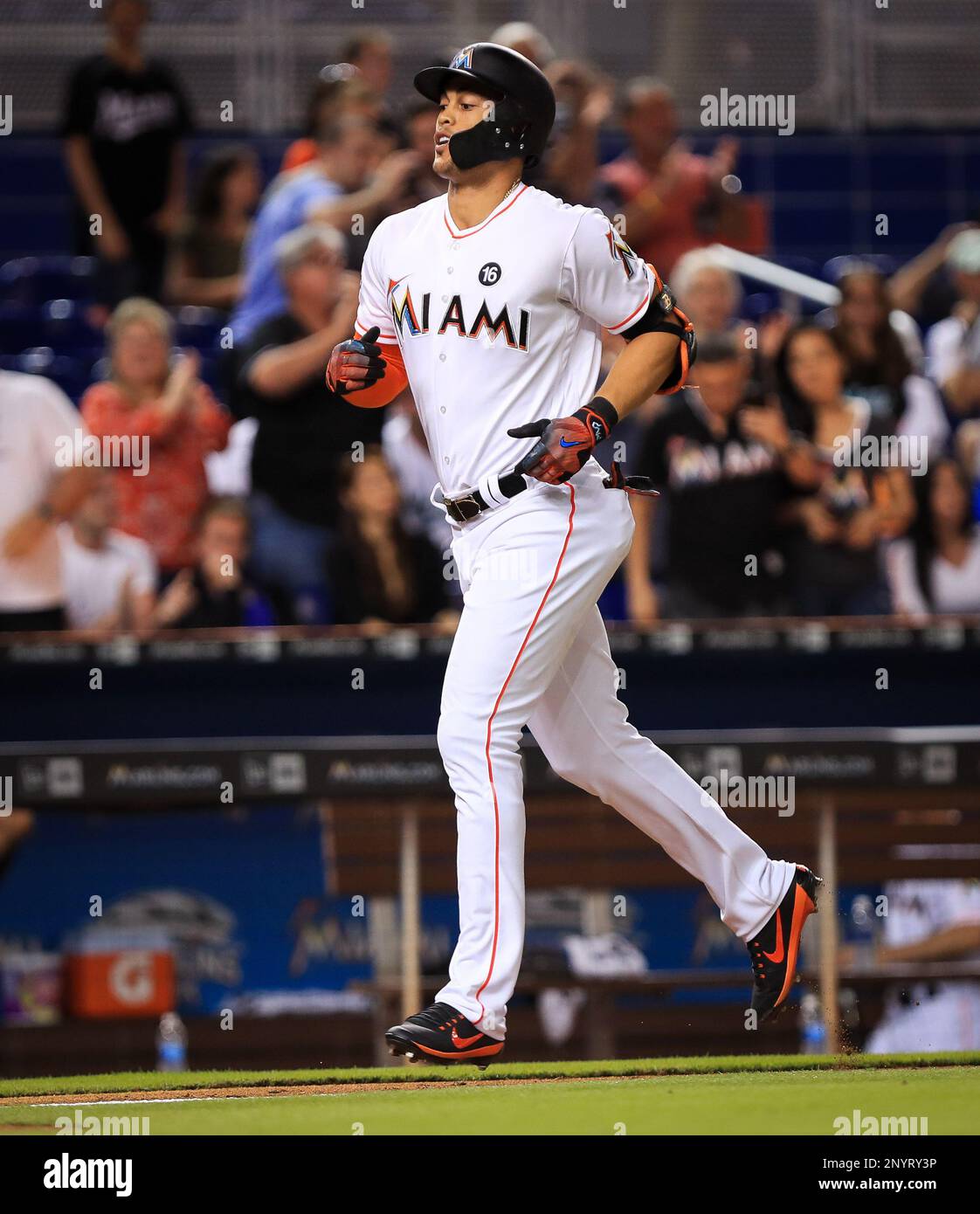 Miami Marlins' Giancarlo Stanton (27) rounds first after hitting a