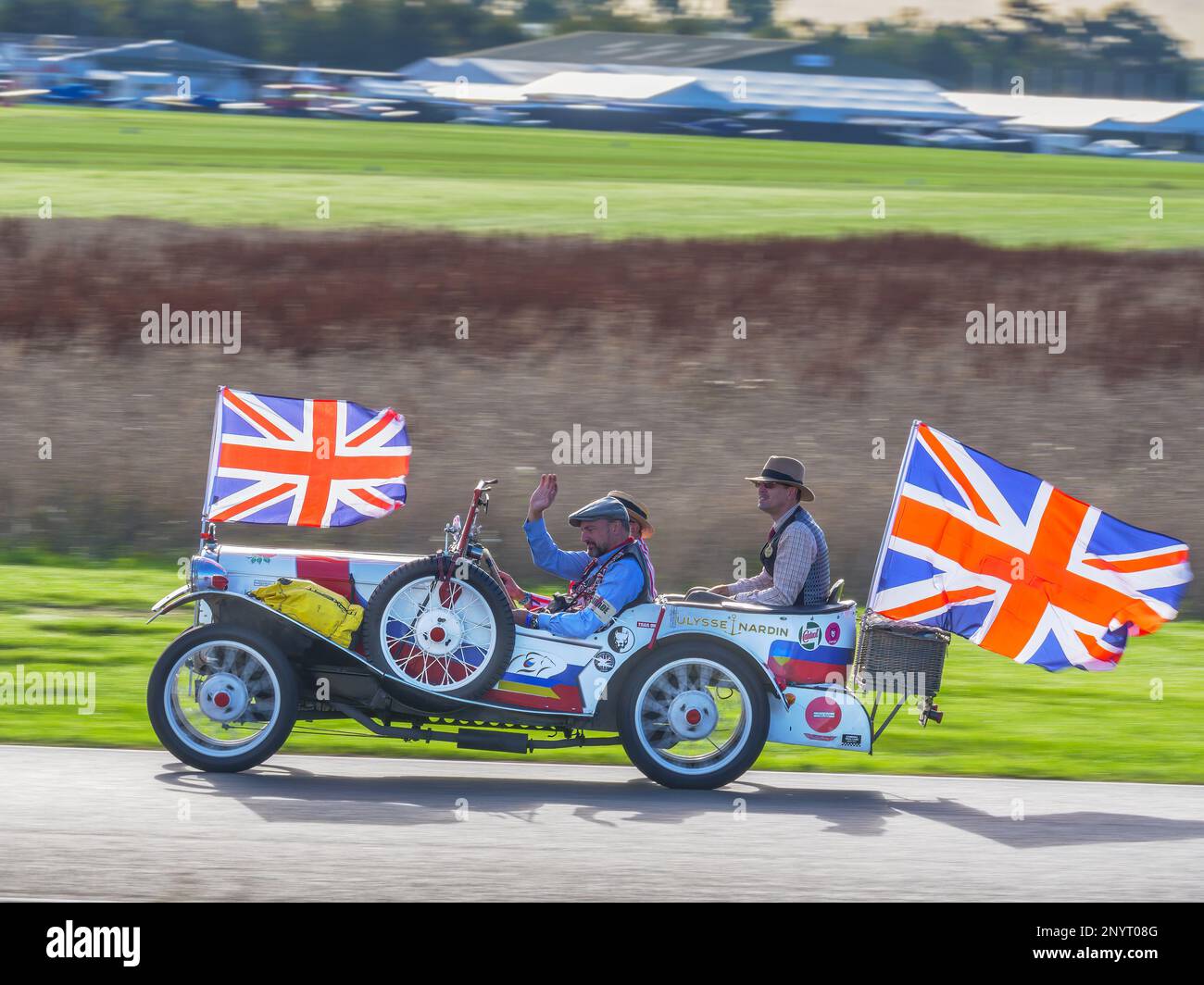 Vintage Austin 7 racing car dressed in union Jacks at the Goodwood Revival 2022, West Sussex, uk
