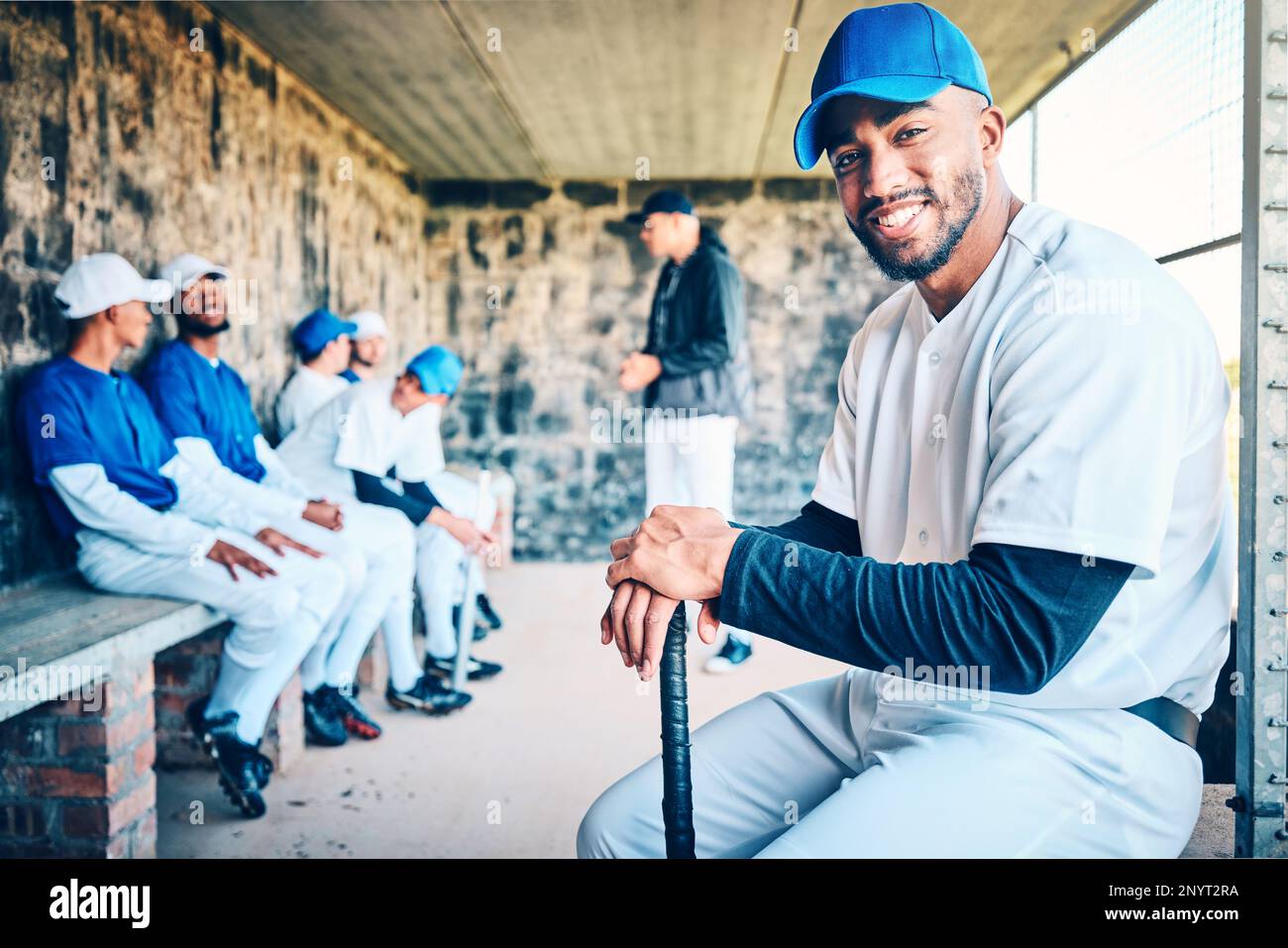 Baseball team, portrait and man from Dominican Republic smile of a player in sports dugout. Exercise, sport training and happiness of an athlete at a Stock Photo