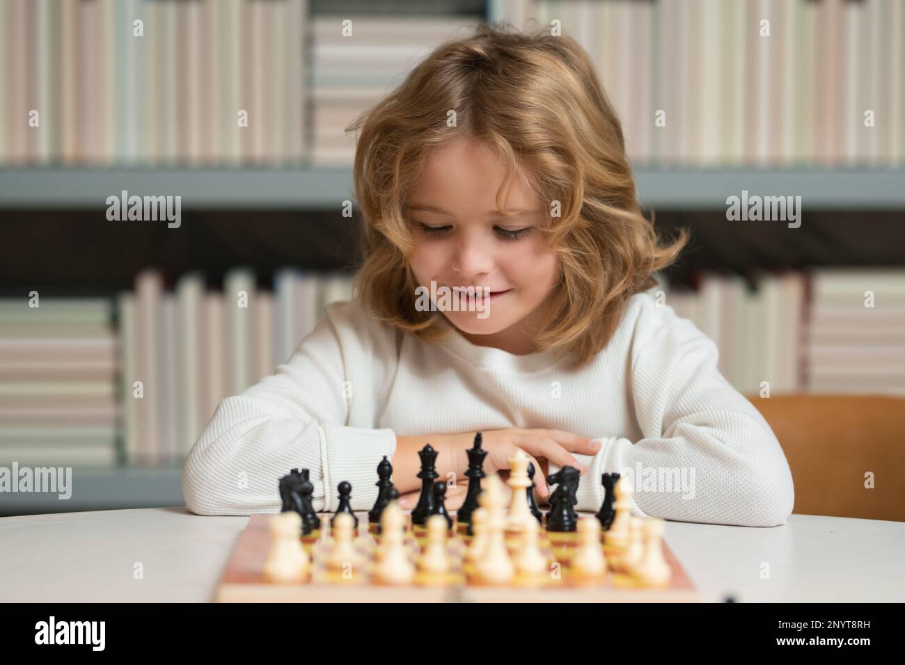 Focused woman thinking about next move and playing chess · Free Stock Photo