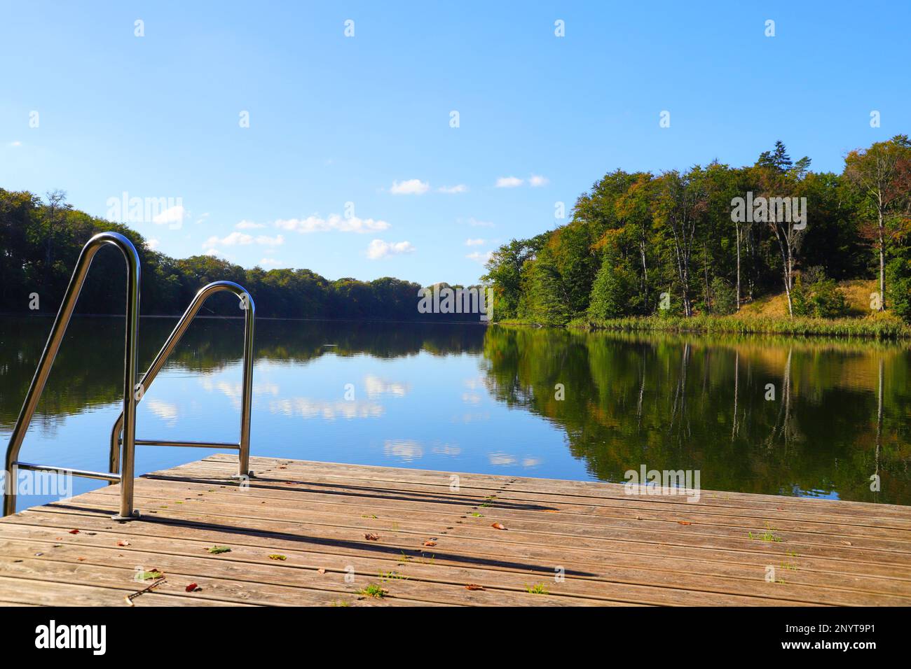 Bathing jetty on Huwenow lake in meseberg in autumn, federal state Brandenburg - Germany Stock Photo