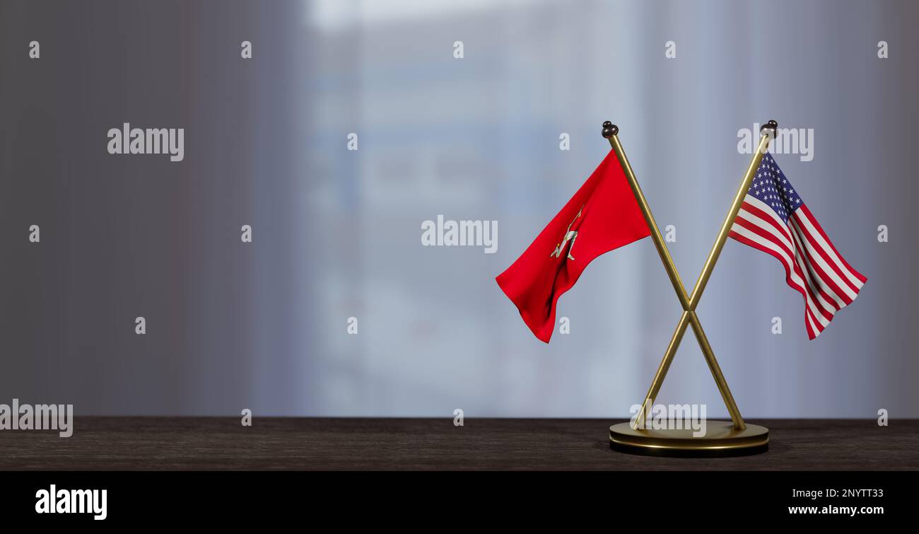 Isle of Mann and USA flags on table. Negotiation between Isle of Mann and United States. on little blur background. 3D work and 3D image Stock Photo
