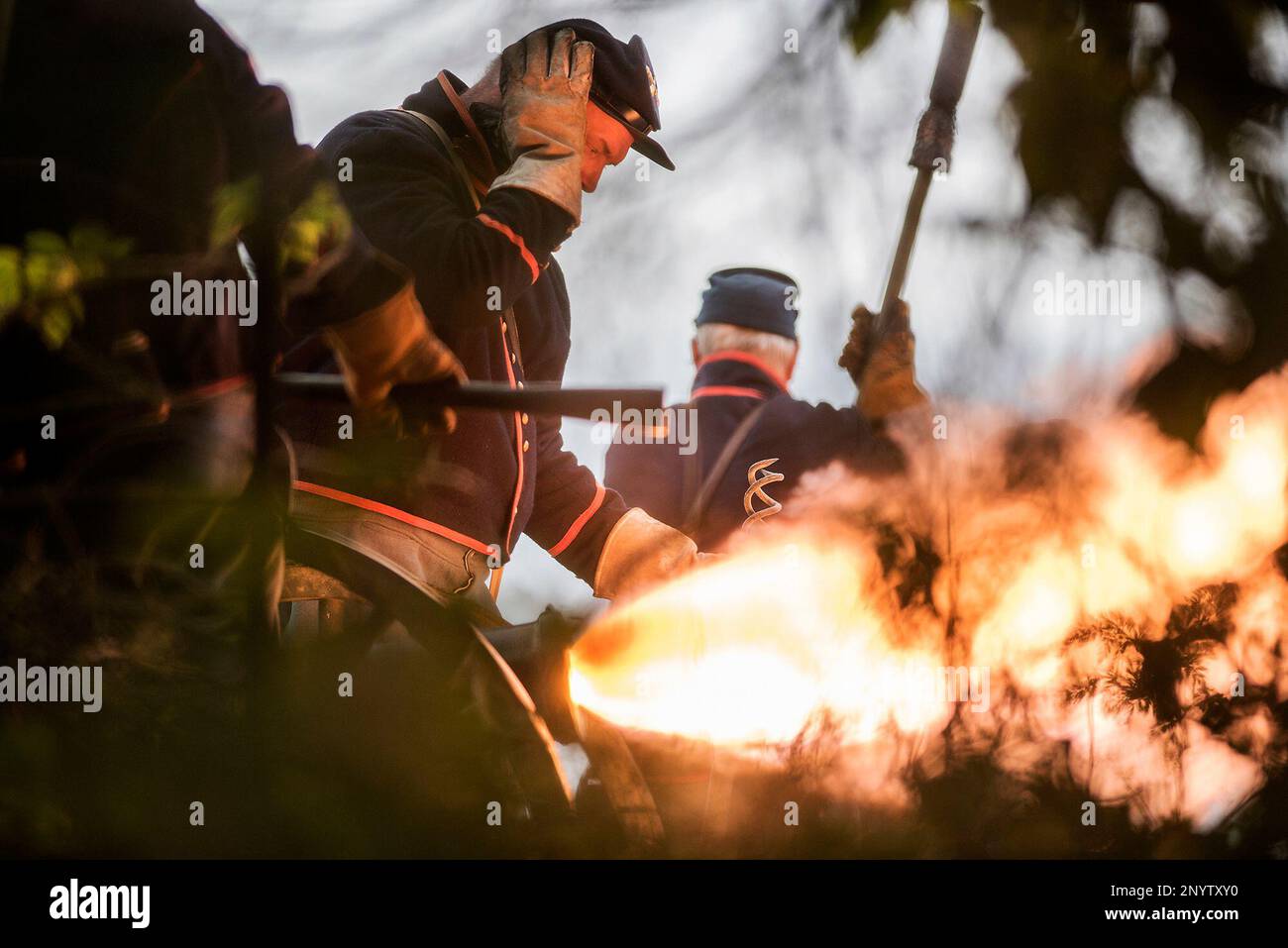 In this May 21, 2017 photo, a Union cannoneer covers his ear as his