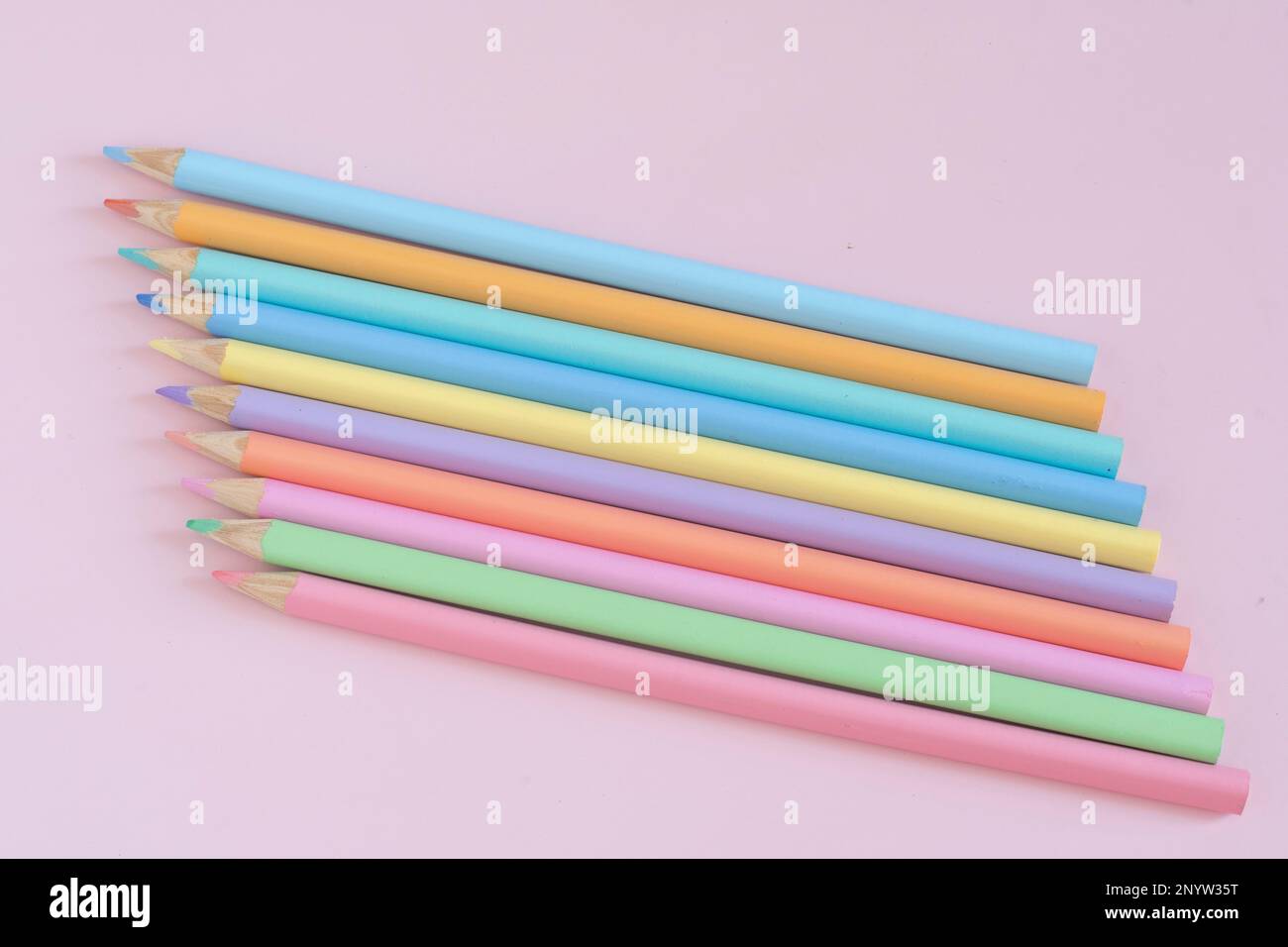 Pastel colored pencils, top view on pink background, illustration concept,  background and education and back to school Stock Photo - Alamy
