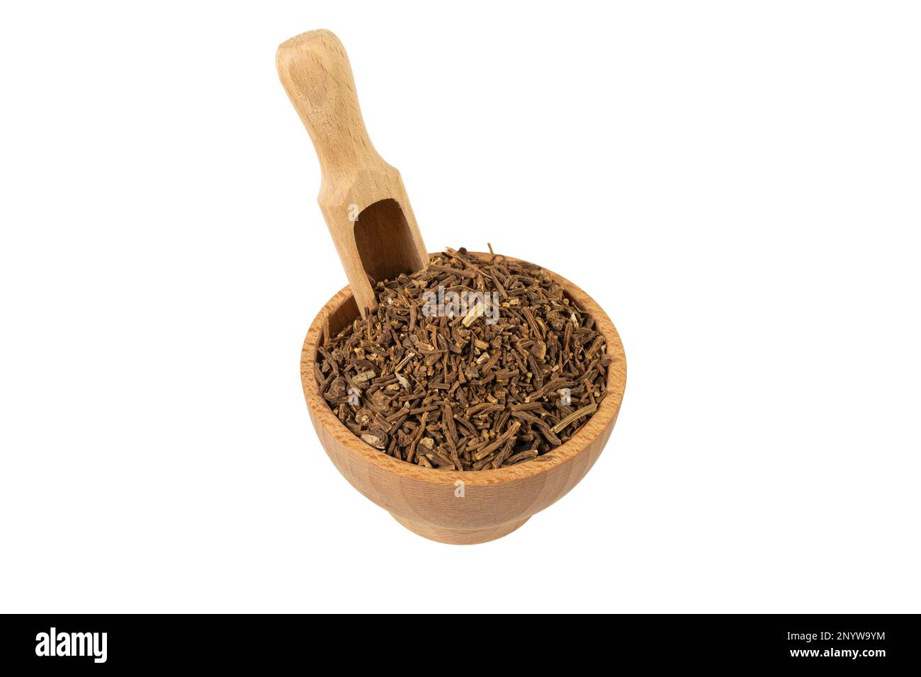 Valerian herb root in wooden bowl and scoop isolated on white background. Valeriana officinalis. used in herbal medicine as a tranquillizer and to tre Stock Photo
