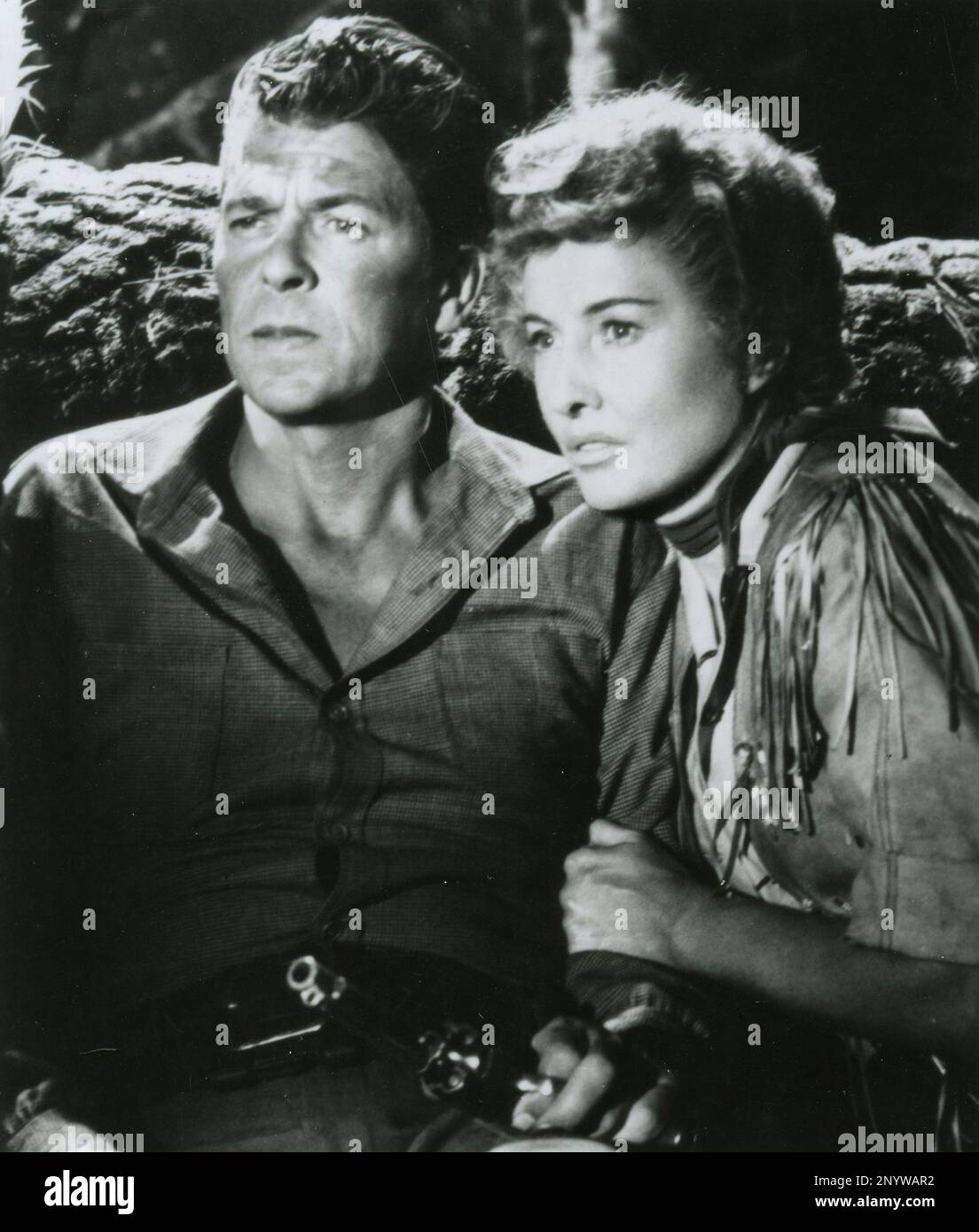 American actor Ronald Reagan and actress Barbara Stanwyck in the movie Cattle Queen of Montana, USA 1954 Stock Photo