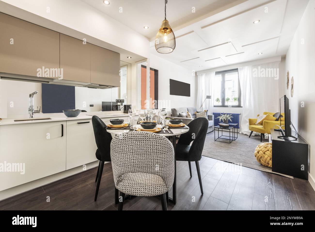Living room of a vacation rental house with kitchen open to the living