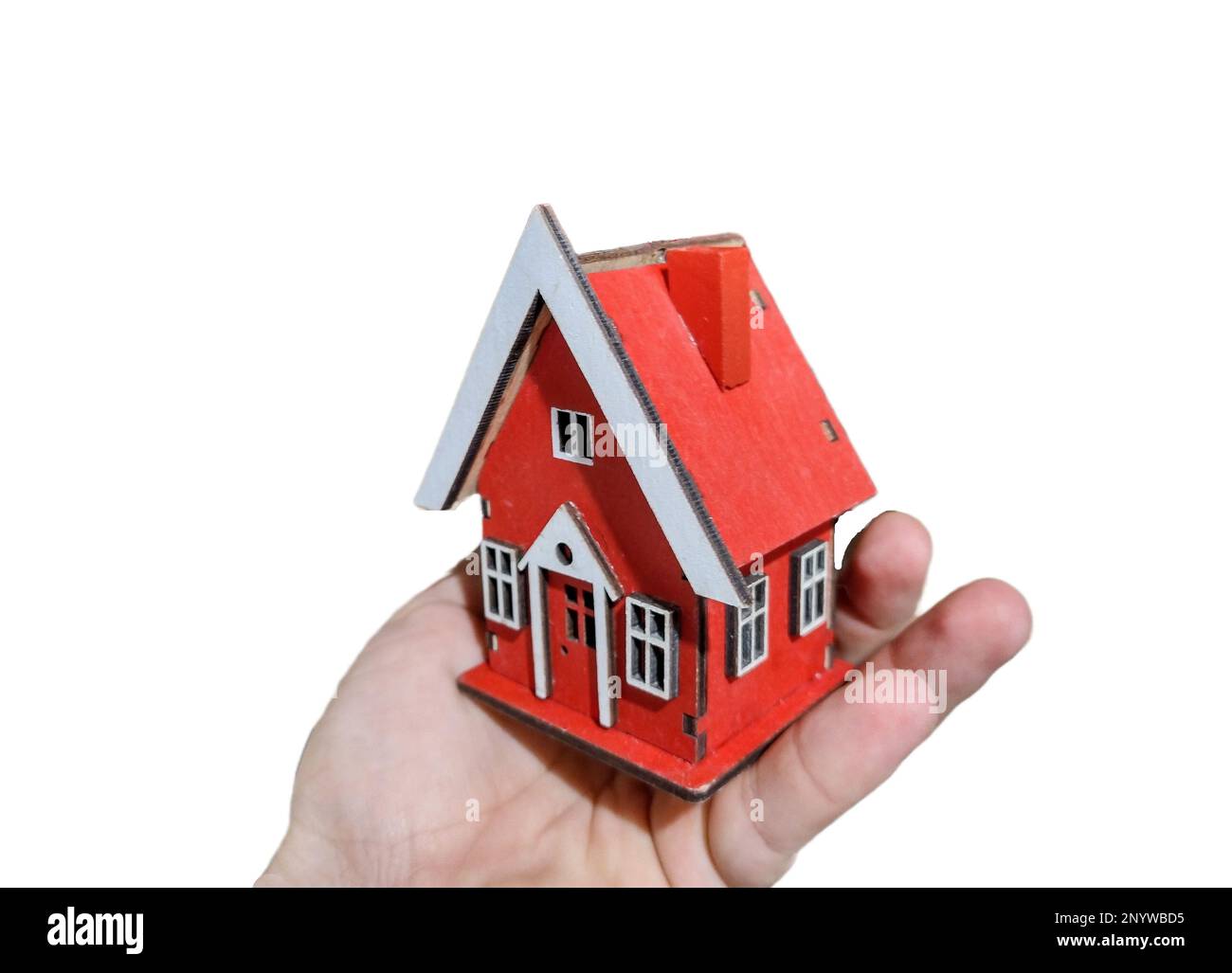 Miniature house in hand. Concept of selling a house, real estate