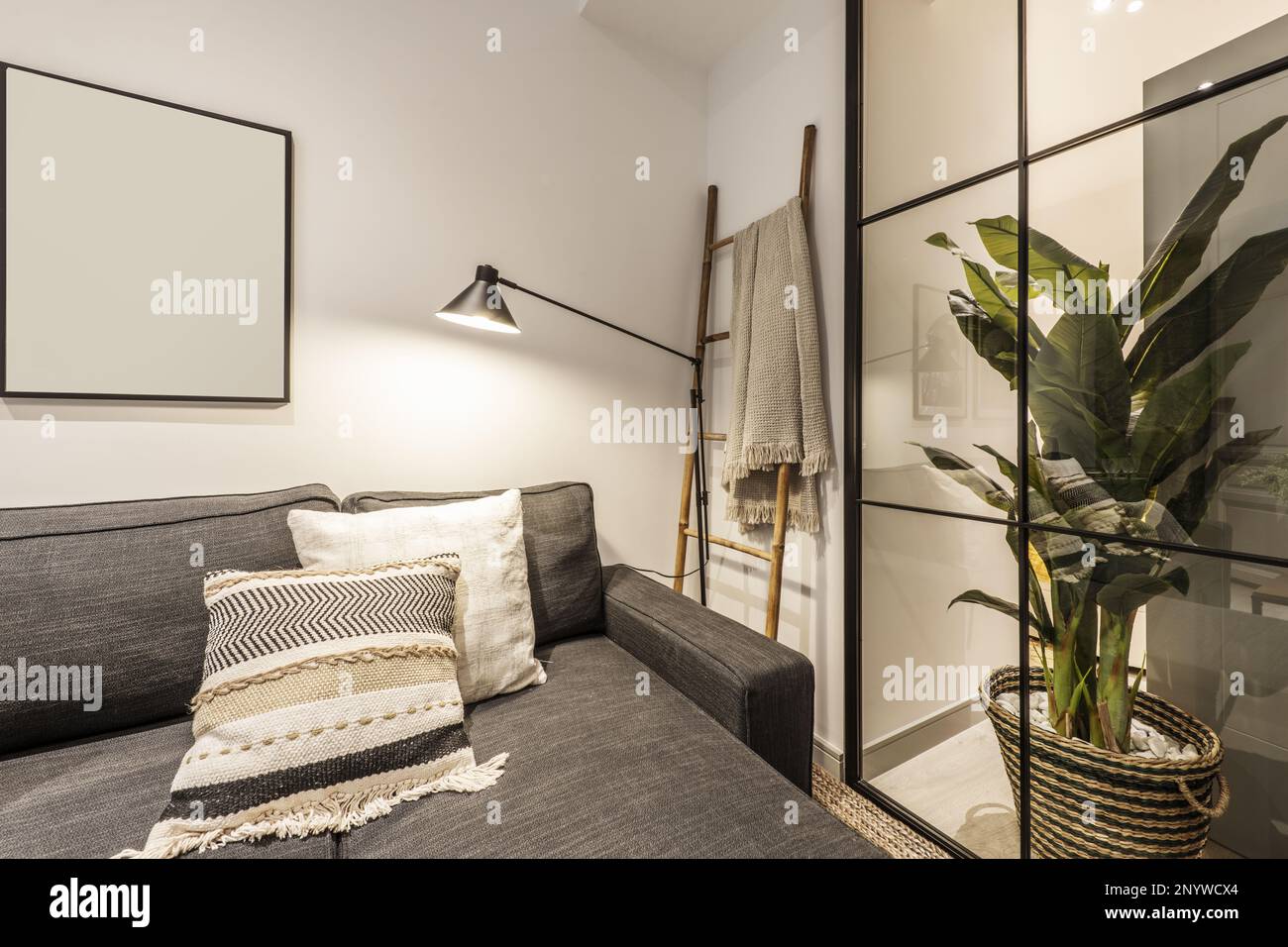 Living room of a loftstyle rental house with a sofa with a chaise