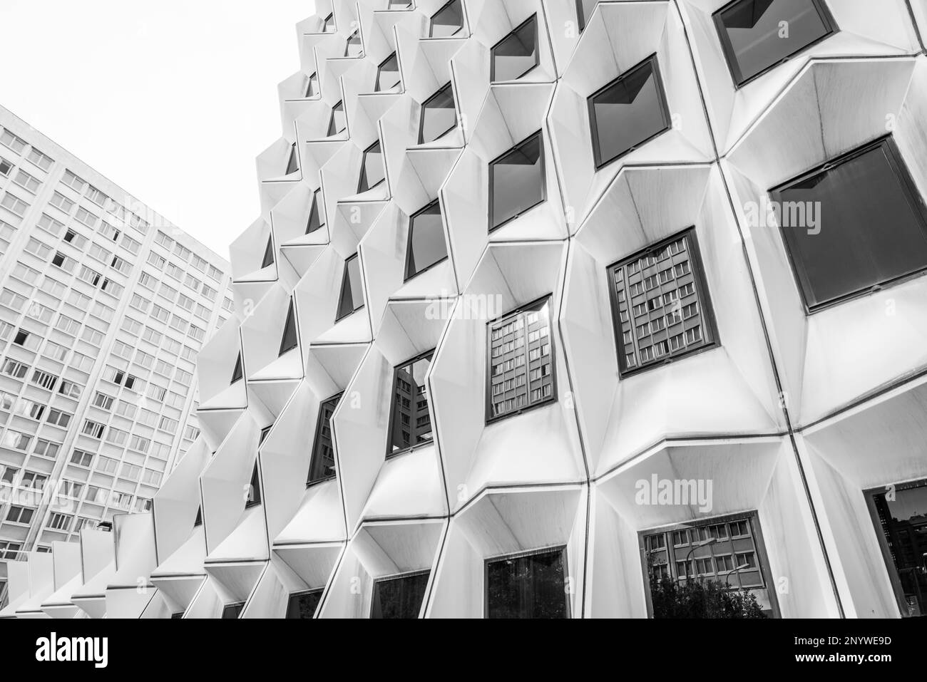 low angle black and white view of office building facades in the city