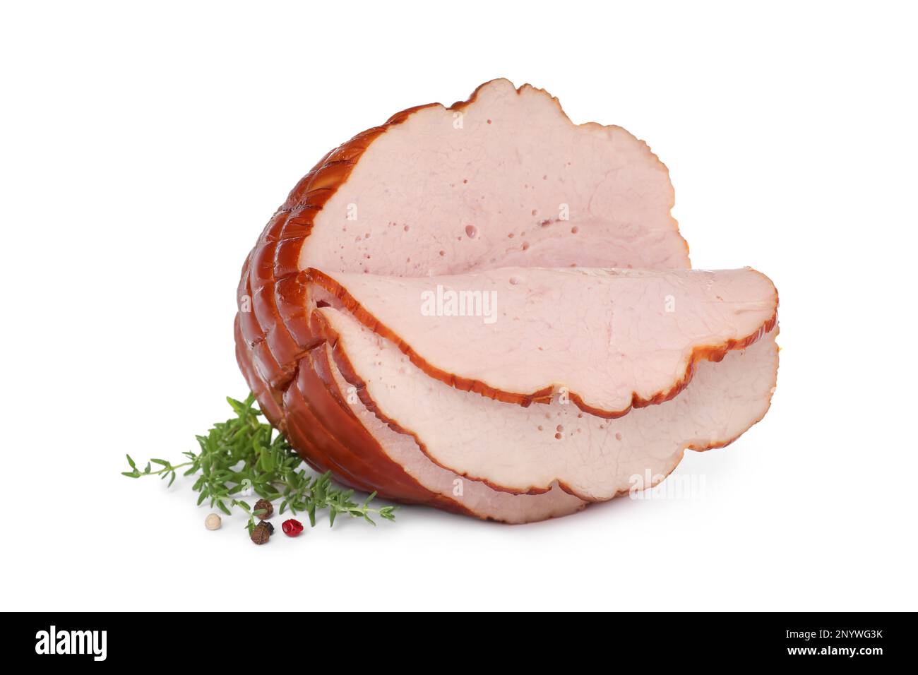 Delicious sliced ham with thyme and peppercorns isolated on white Stock