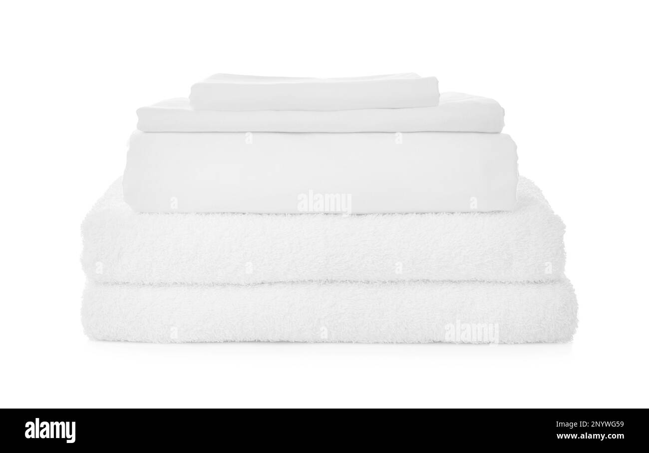 Stack of towels and bed sheets on white background Stock Photo Alamy