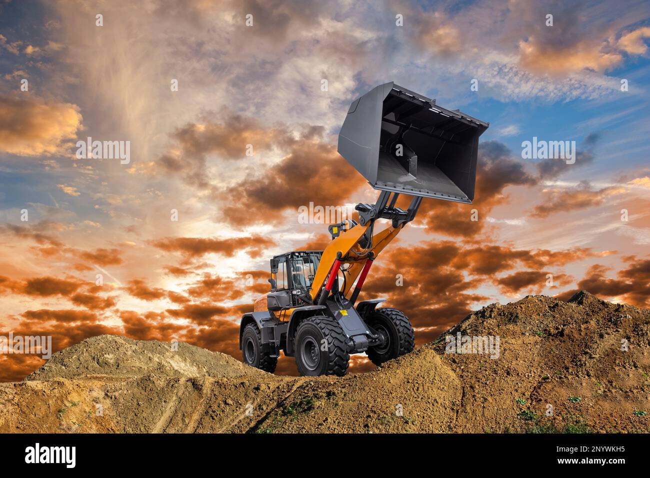 excavator ist digging and working at construction site Stock Photo