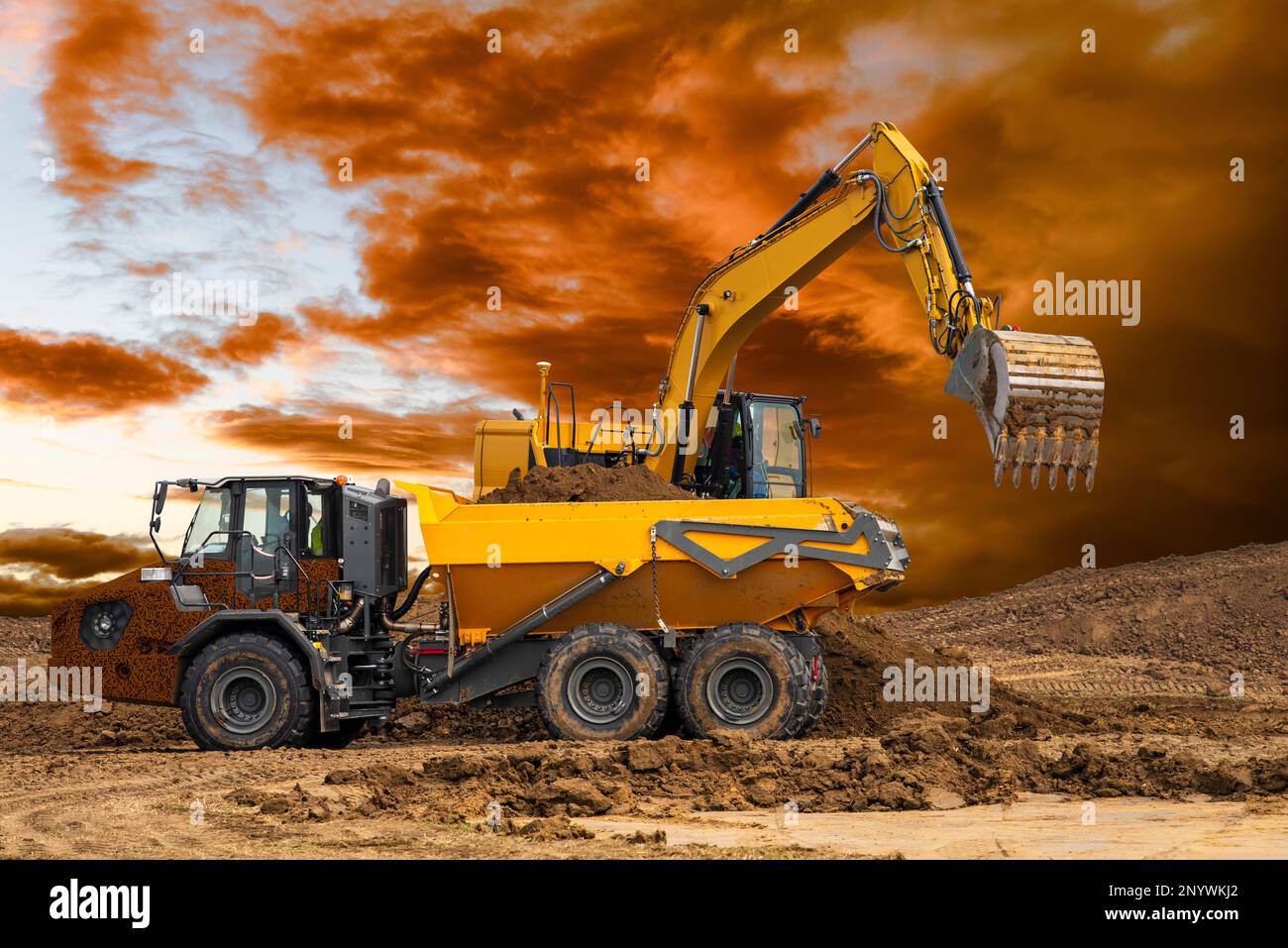 excavator ist digging and working at construction site Stock Photo