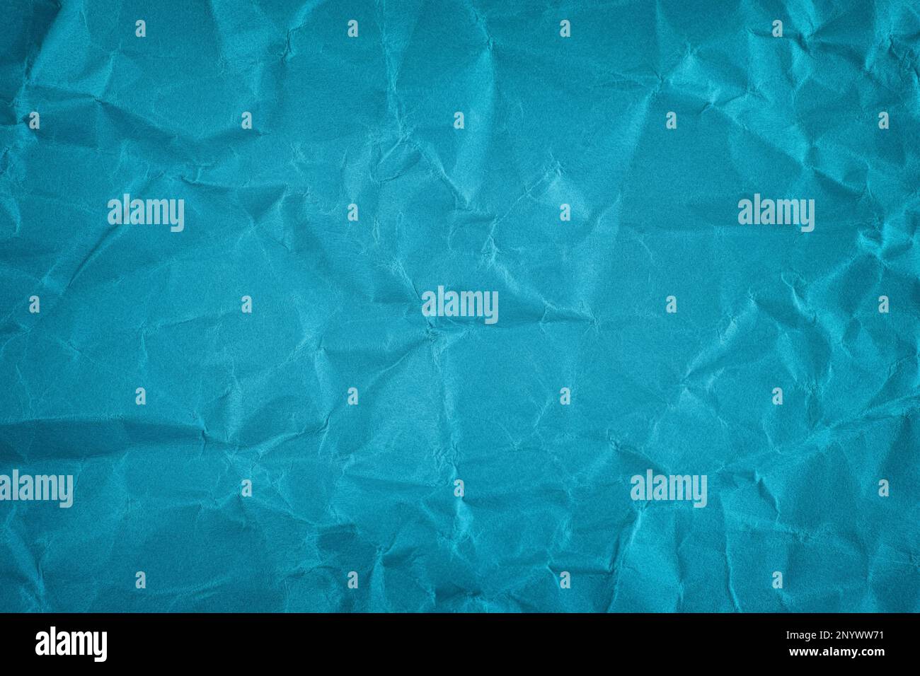 A crumpled blue paper background. Close up. Stock Photo