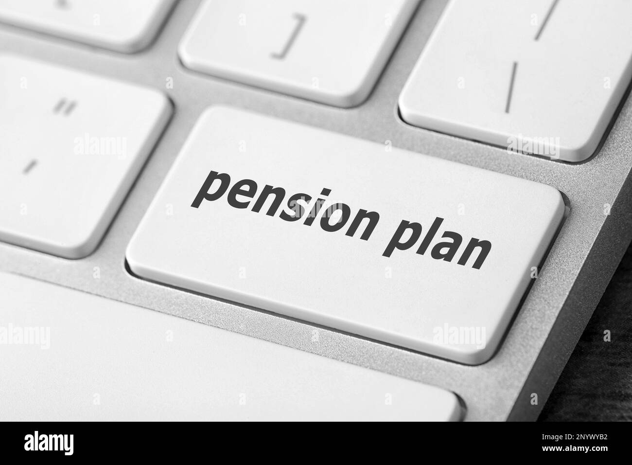 Modern computer keyboard with text Pension Plan on button, closeup view Stock Photo