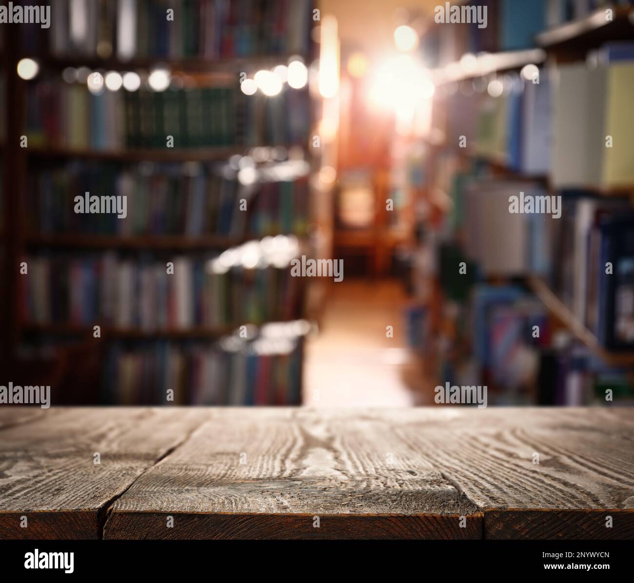 Empty wooden table in library. Space for design Stock Photo - Alamy