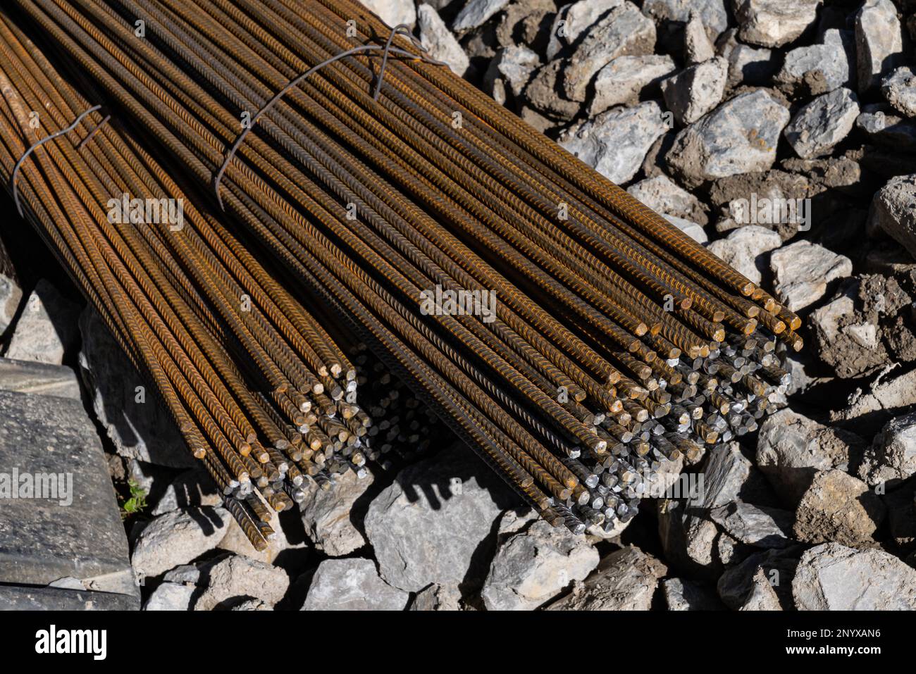 Bundles of rebar lying on a gravel pavement. Close up Stock Photo Alamy